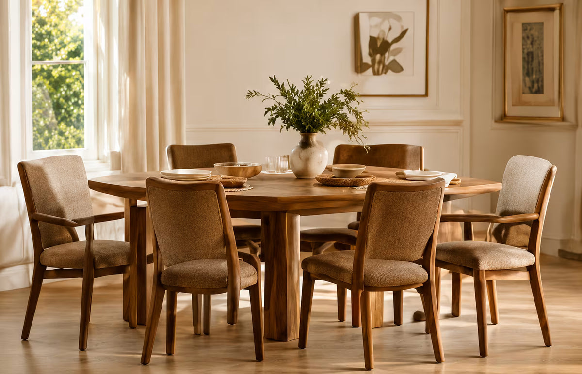 Round wooden dining table with upholstered chairs