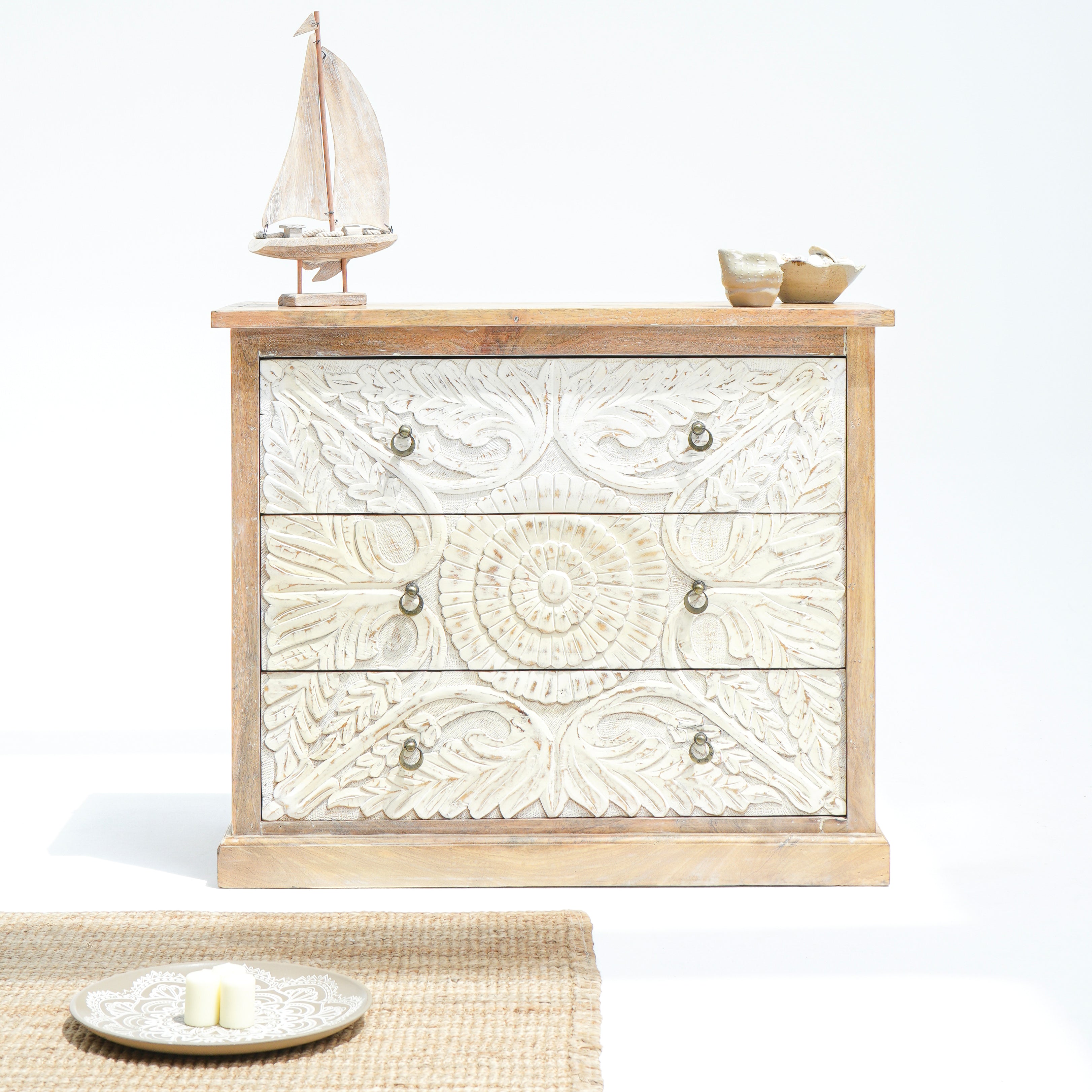 Artcian crafted  carwed three drawer chest of drawer