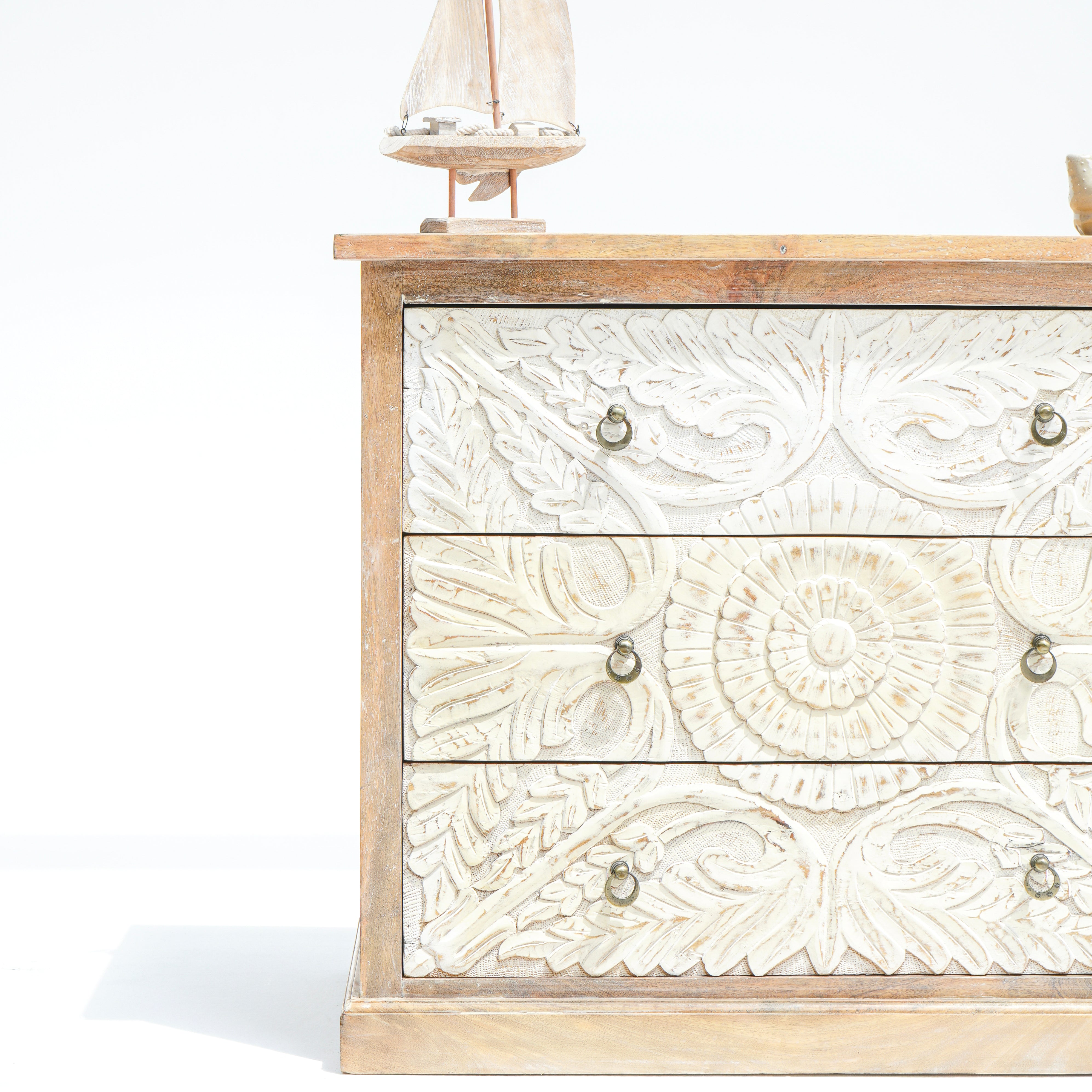 Artcian crafted  carwed three drawer chest of drawer