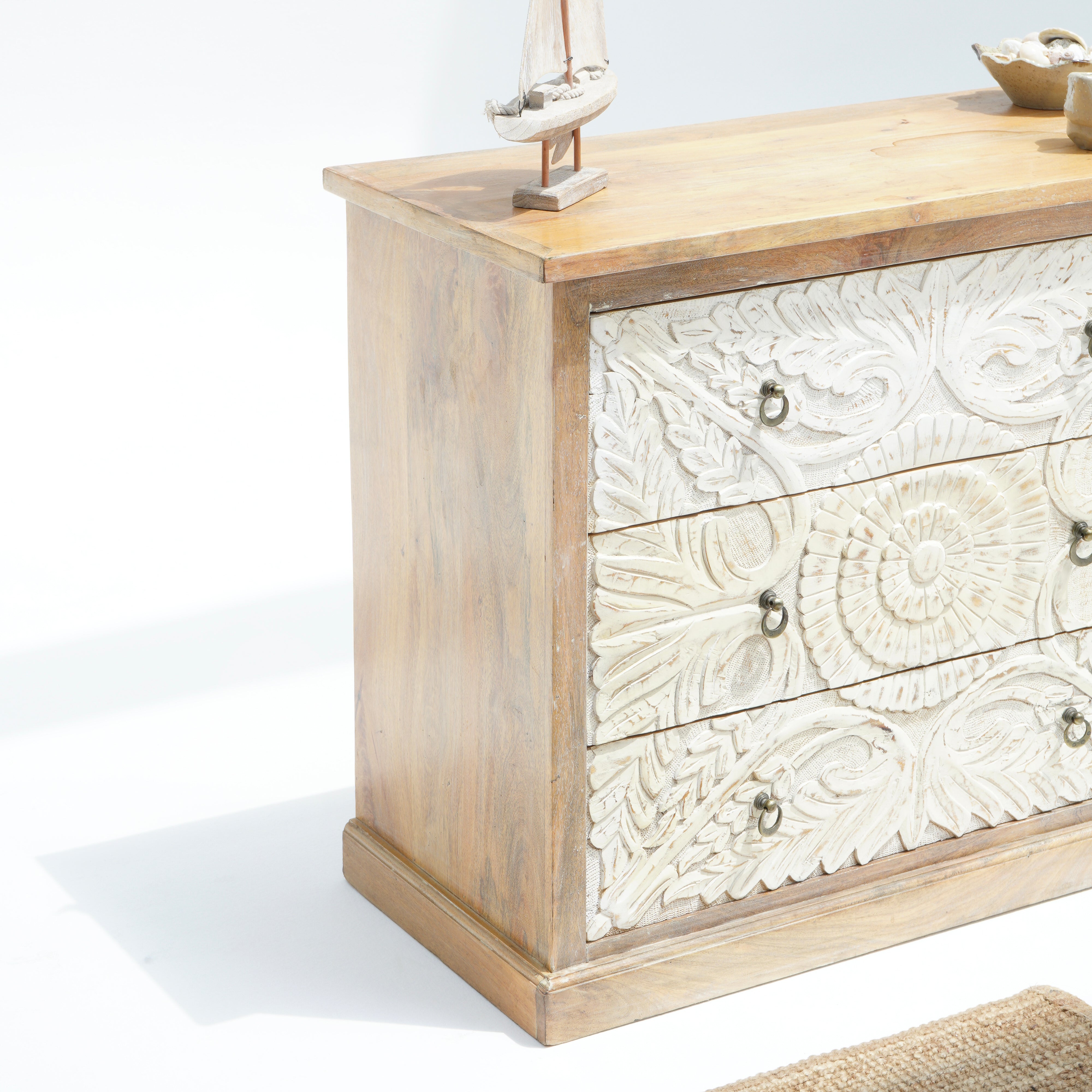 Artcian crafted  carwed three drawer chest of drawer
